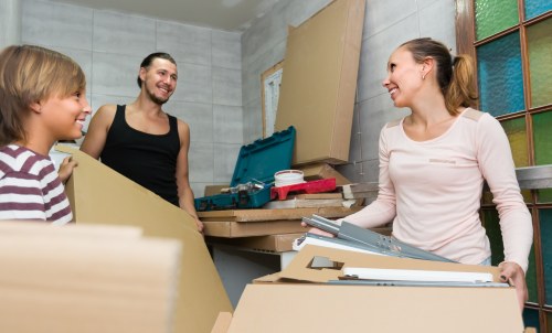 Removal team preparing furniture safely during a planned move