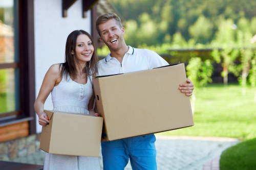 Professional movers packing household items in Battersea